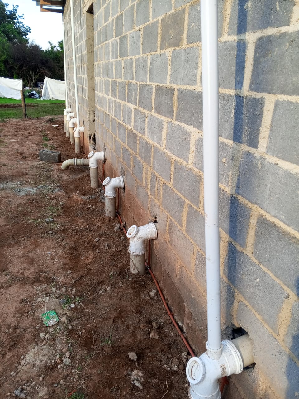Plumbing line installation outside a building