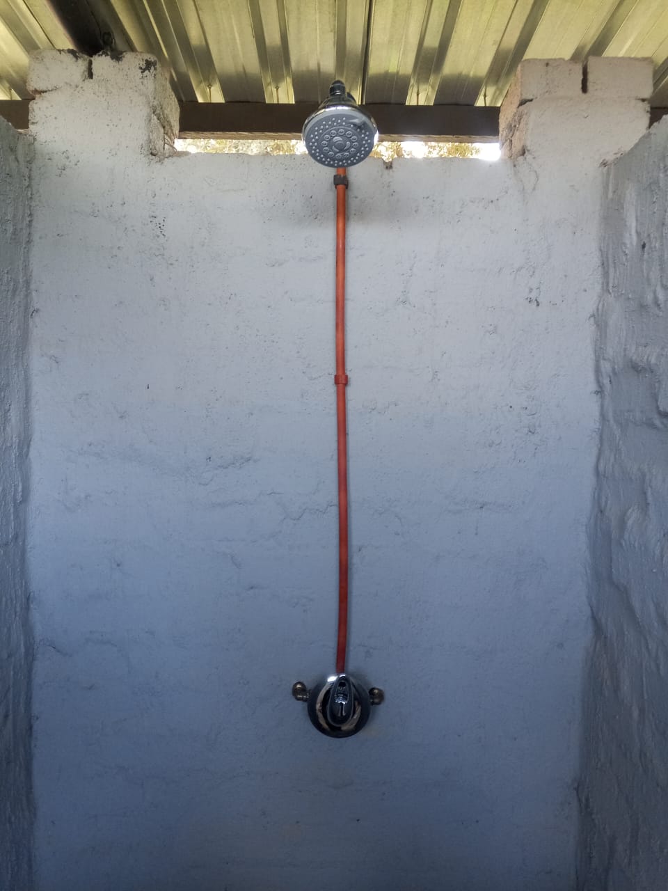 Orange pipe shower installation