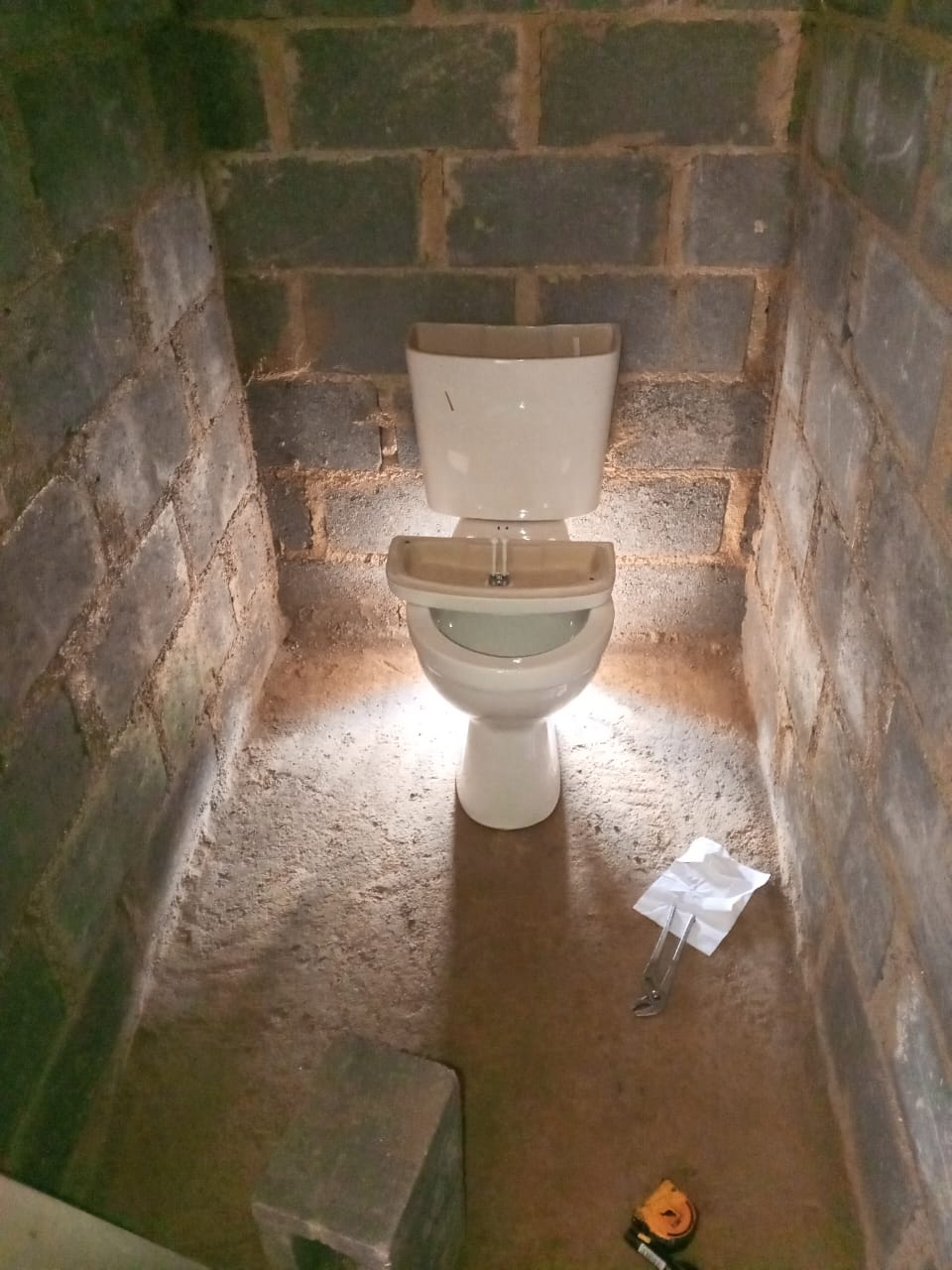 Toilet installation inside unfinished room